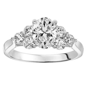 Oval Engagement with Diamond Clusters